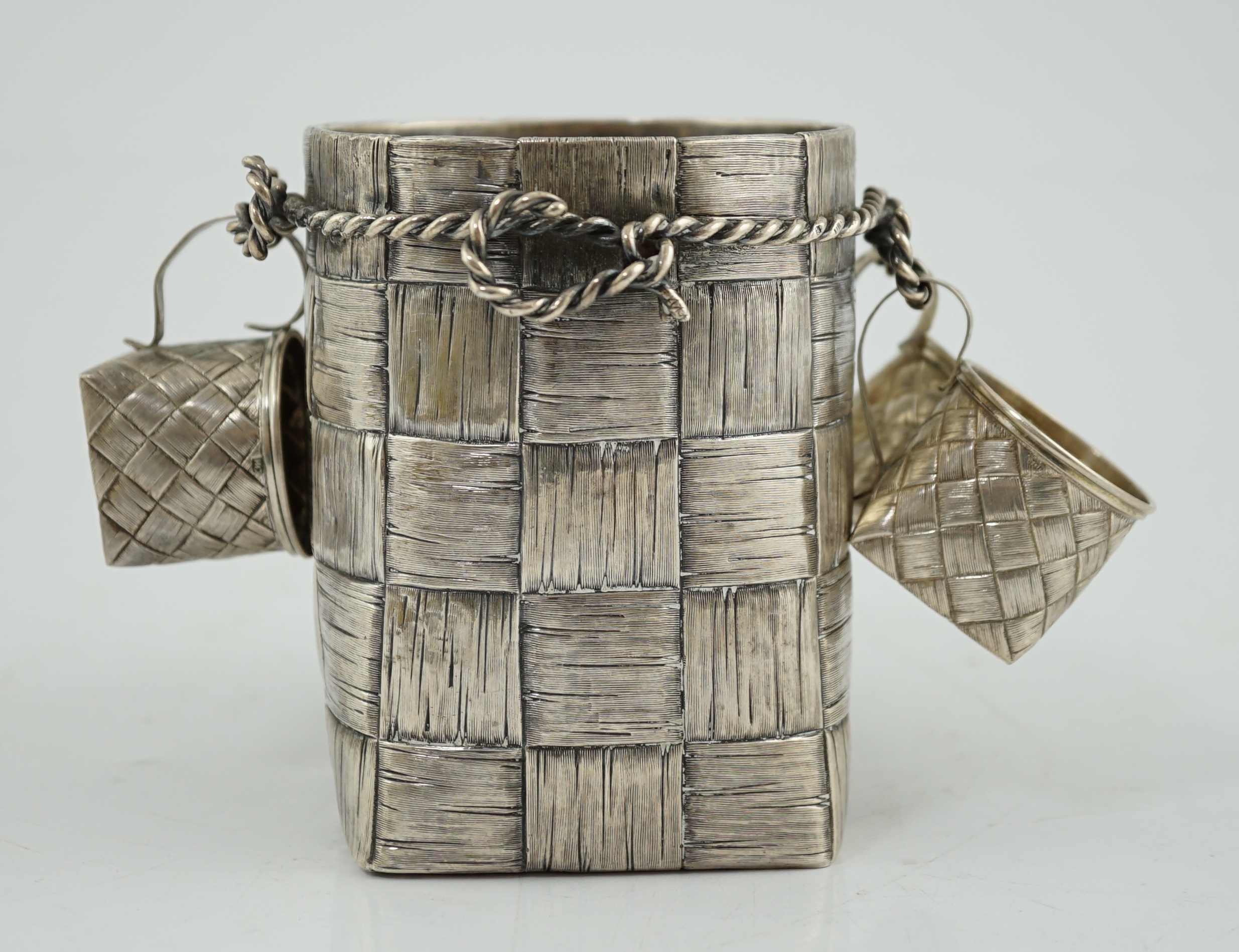 A late 19th century Russian 84 zolotnik silver bottle holder, with basket weave decoration, together with five similar tots